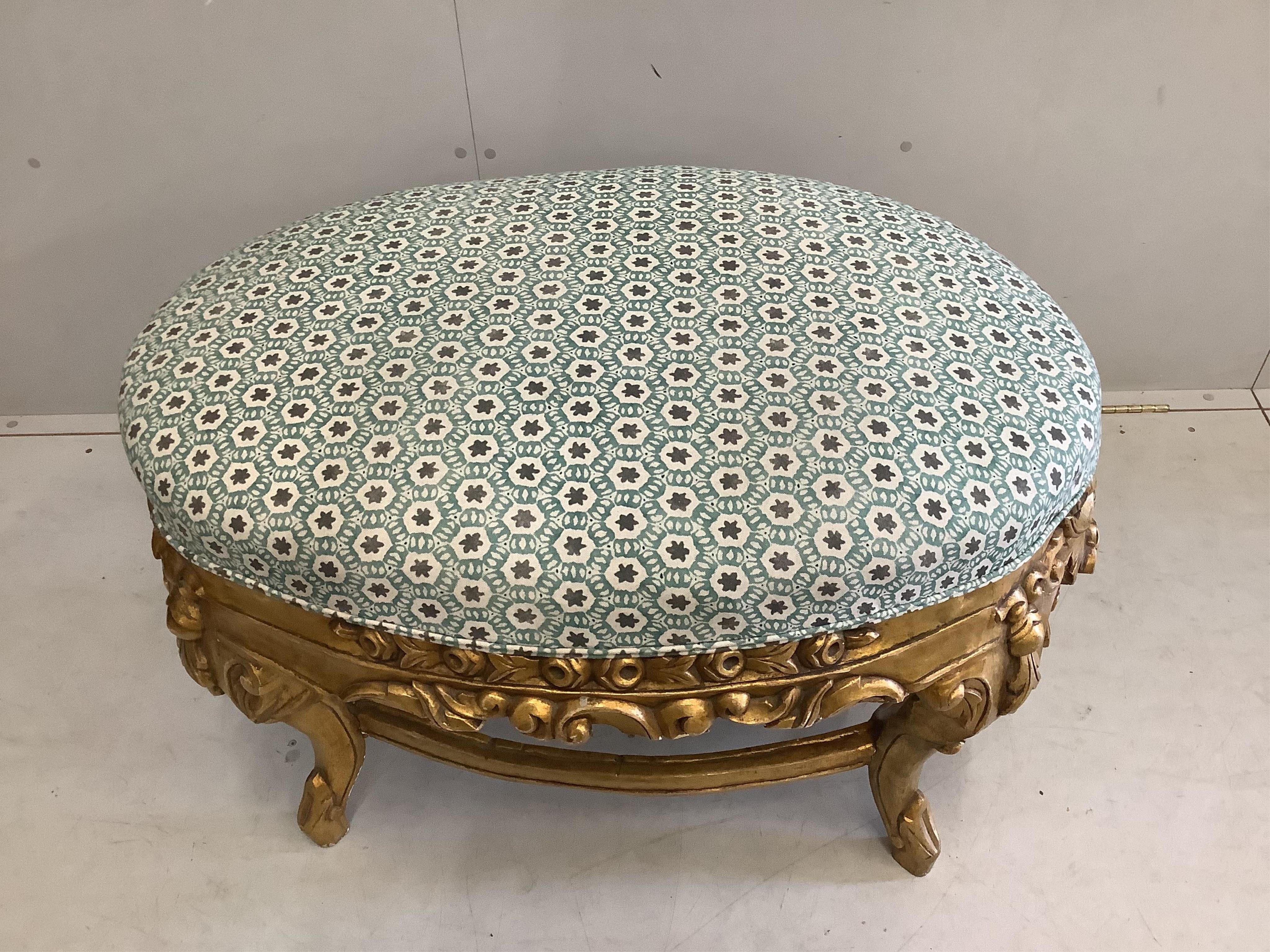A large 18th century style gilt framed oval stool, width 96cm, depth 60cm, height 60cm. Condition - good